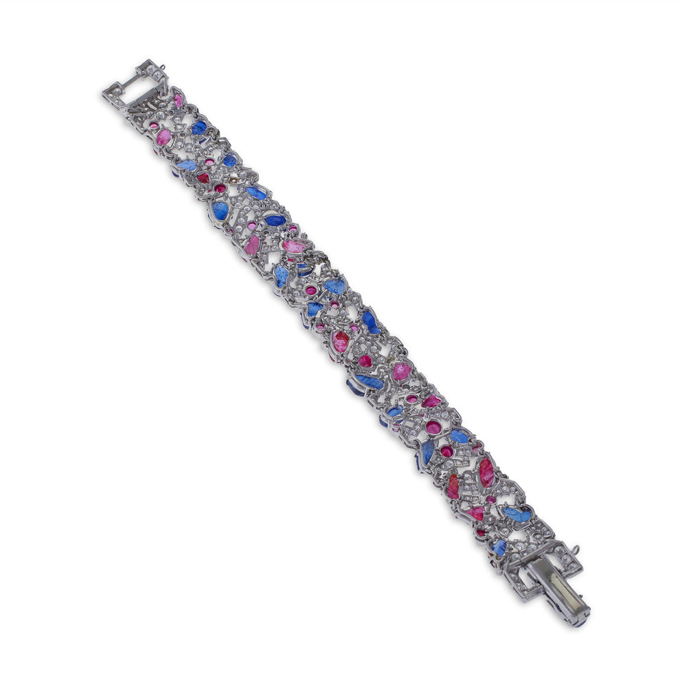 
                      
                        Macklowe Gallery Carved Ruby, Sapphire and Diamond Tutti Frutti Strap Bracelet
                      
                    