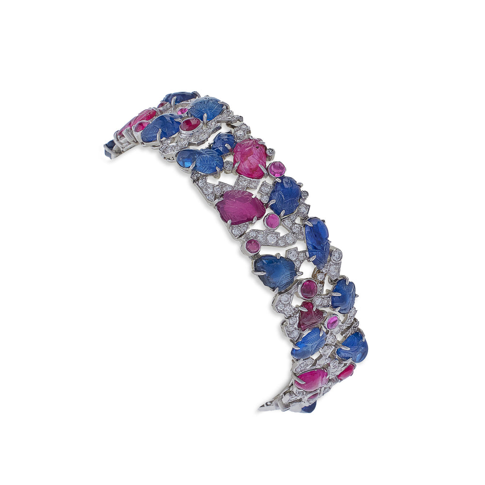 
                      
                        Macklowe Gallery Carved Ruby, Sapphire and Diamond Tutti Frutti Strap Bracelet
                      
                    