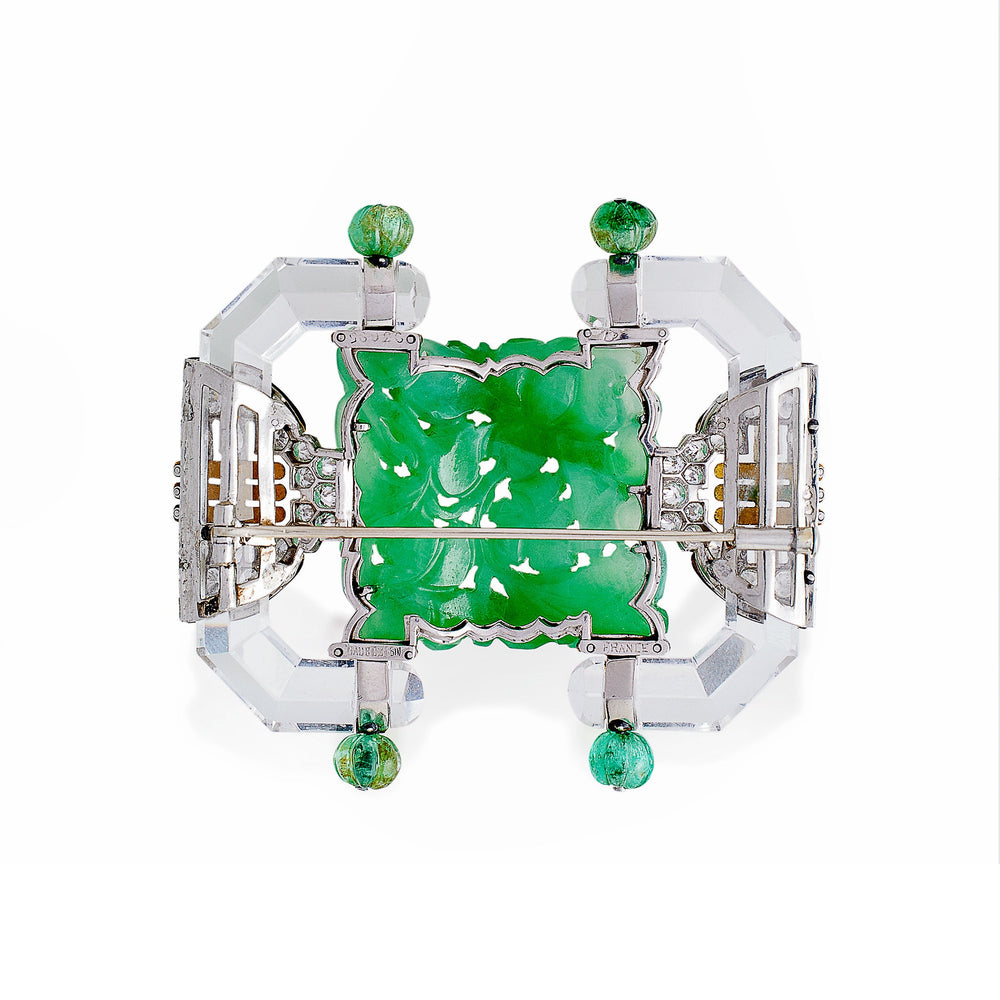 
                      
                        Macklowe Gallery Mauboussin Paris Carved Rock Crystal, Jadeite and Emerald Brooch
                      
                    